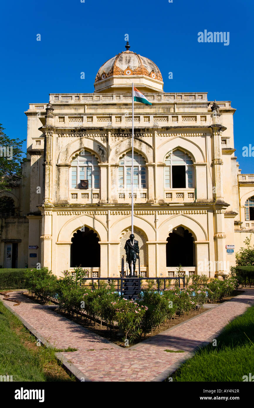 Gandhi Memorial Museum building in Madurai with lush garden surroundings